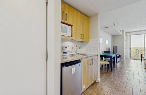 Baytowne Wharf Apartment | Stylish suite with a shared pool/hot tub and golf course/bay views