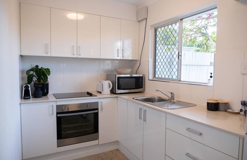 Parramatta Park Apartment | Stylish Tropical Retreat with Private Courtyard & Prime Location