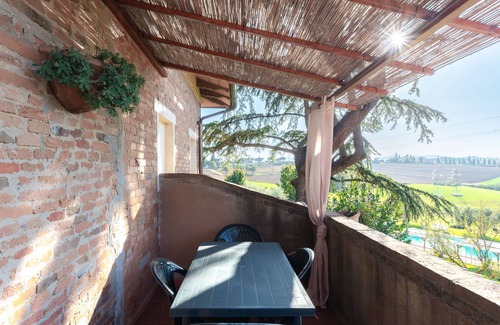Castiglione del Lago Apartment | Suite with panoramic balcony, pool view and beautiful sunsets