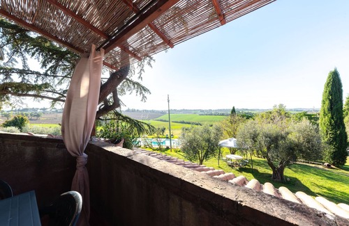 Castiglione del Lago Apartment | Suite with panoramic balcony, pool view and beautiful sunsets