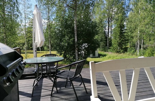 Kuopio Apartment | Summer Hill is a apartment in a former school with a big yard a lake nearby.