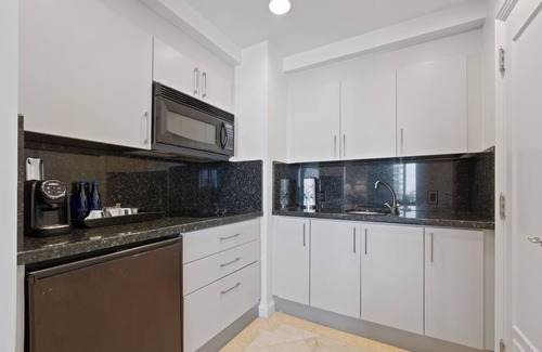 Barrier Island Hotel | Sun-kissed Sanctuary: Unit with Partial Ocean View, Pet-friendly, Swimming Pool!
