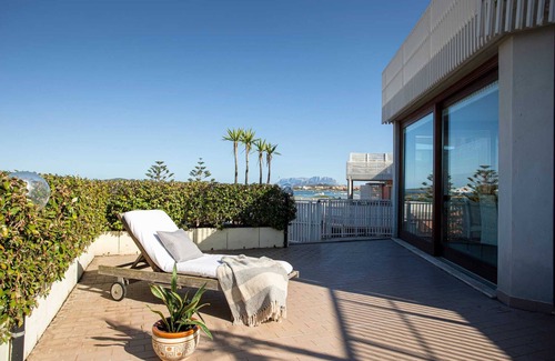 Olbia Apartment | Sunny rooftop loft with gorgeous views of Olbia