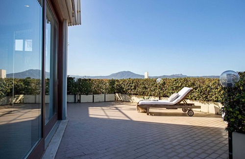 Olbia Apartment | Sunny rooftop loft with gorgeous views of Olbia