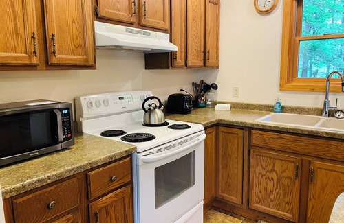 Hayward House | Sunset on the Bay 3-bedroom vacation rental on Nelson Lake w/Private Dock!