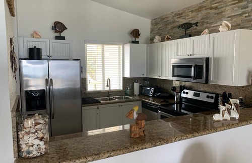 Alice Town Condo | Sunsets In Paradise, third floor condo with breathtaking sunsets and ocean views