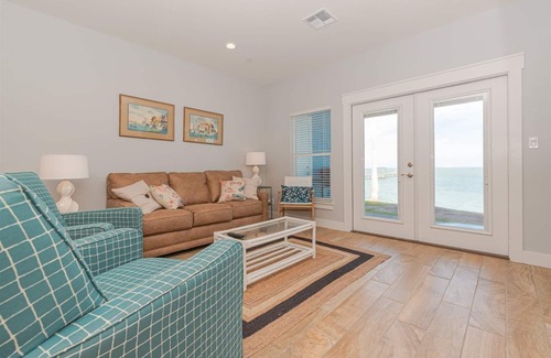 Rockport Condo | Sweeping views of Copano Bay from this newly constructed ground floor condo with a pool and a new fishing pier!
