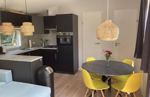 Sint Maartensvlotbrug House | Tastefully furnished, cosy and modern 4-person chalet with 2 bedrooms. Lovely garden with terrace, veranda and lawn. Free WiFi.