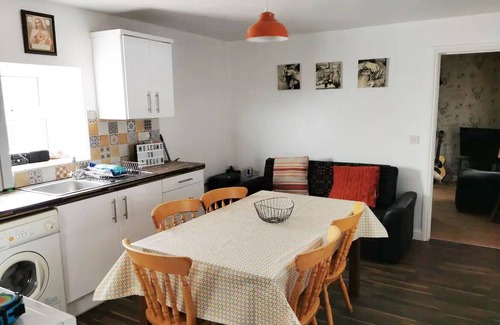 Carrick Cottage | Teach Condy's Cottage nestled at the bottom of Sliabh Liag Cliffs, Co. Donegal