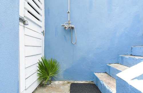 Dunmore Town House | The Blue Bungalow: A charming cottage set above the water in Harbour Island