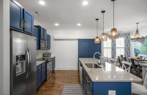 Wilmington Beach House | The Blue House at Carolina Beach, swim spa, ping pong, bikes & pet friendly!
