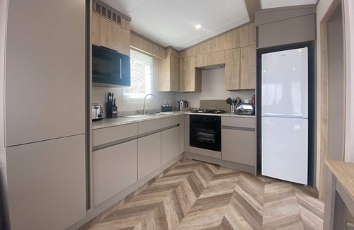 Dawlish House | The Firs Plus are an upgrade from the Firs mini lodge and has 3 bedrooms.
