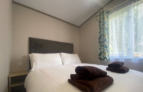 Dawlish House | The Firs Plus are an upgrade from the Firs mini lodge and has 3 bedrooms.