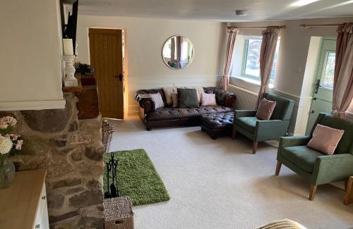 Pontesbury House | The lodge spa with sauna hot tub outdoor kitchen with firepit area