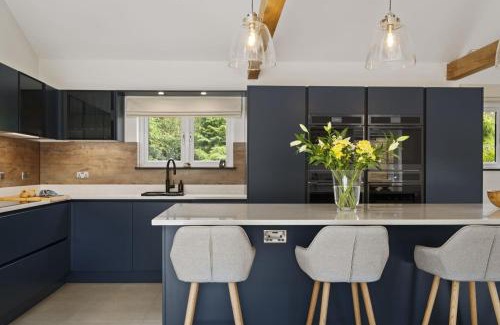 Porthyrhyd House | The Old School House - A Superb Newly Converted Barn with Hot Tub Sleeping 8 guests