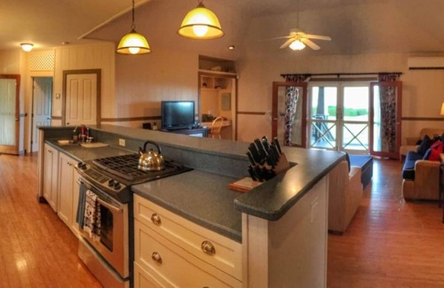 Hanalei House | This beautiful beachfront Hanalei Bay home is located steps from the sand