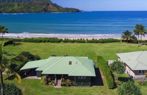 Hanalei House | This beautiful beachfront Hanalei Bay home is located steps from the sand