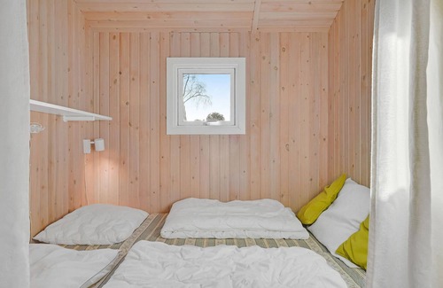 Østerskov House | This beautiful wooden house is located in a smaller cottage area, nestled in beautiful nature.