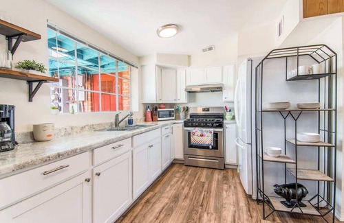 The Garden District House | This centrally located 3 bedroom 2 bathroom features a full size pool and electric vehicle charging on site.