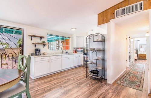 The Garden District House | This centrally located 3 bedroom 2 bathroom features a full size pool and electric vehicle charging on site.