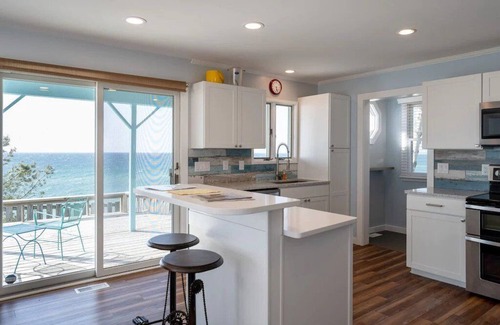 Mears House | This charming vacation home sits directly on Lake Michigan and it delivers!