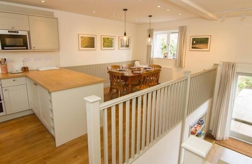 Brancaster Staithe Cottage | This delightful cottage has a fabulous open-plan kitchen/dining area with fitted kitchen. French doo