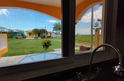 Colon House | This Hidden paradise located right on the Caribbean Ocean & big tall Mountains.