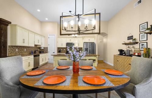 Biggs Field House | This is a true retreat in El Paso with a sparkling pool (w heater), hot tub, and full outdoor entertaining area with a 55" smart TV, tiki bar, and grill.