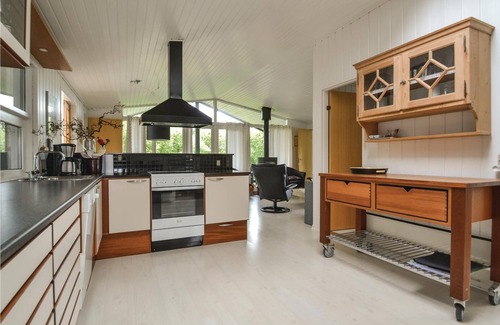 Rindby Strand House | This renovated cottage has among other things a beautiful kitchen with skylight, window front to the