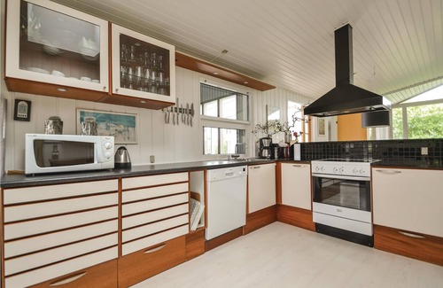 Rindby Strand House | This renovated cottage has among other things a beautiful kitchen with skylight, window front to the