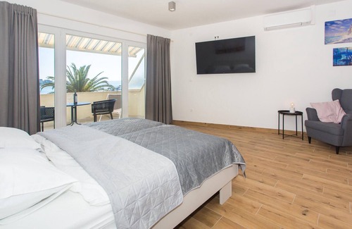 Stobrec Apartment | This simply furnished studio apartment with a shared barbecue and garden is located on the second fl