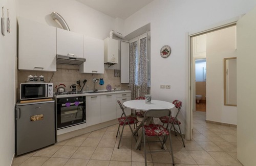Salario Apartment | This spacious 55sqm apartment with four bedrooms is able to accommodate up to 8 people. Located on the first floor (with elevator not suitable for disabled) of a restored period building, the apartment overlooks the private park of Villa Albani, one of t