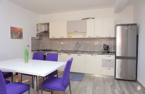 Seget Vranjica Apartment | Three bedroom apartment with terrace and sea view Seget Vranjica, Trogir (A-17989-a)