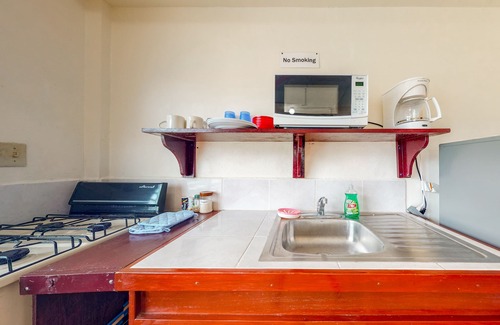 Caye Caulker Apartment | Three vibrant studios w/full kitchens, adult bikes, free WiFi & partial AC