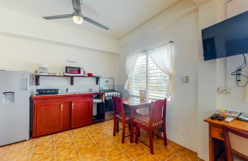 Caye Caulker Apartment | Three vibrant studios w/full kitchens, adult bikes, free WiFi & partial AC