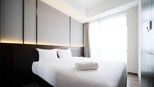 Surabaya Apartment | Tidy and Spacious 2BR at Grand Sungkono Lagoon Apartment By Travelio
