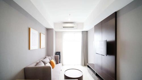 Surabaya Apartment | Tidy and Spacious 2BR at Grand Sungkono Lagoon Apartment By Travelio