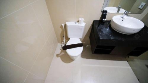 Surabaya Apartment | Tidy and Spacious 2BR at Grand Sungkono Lagoon Apartment By Travelio
