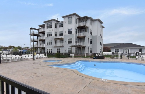 Ludington Condo | Toes in the Sand at One Ludington Place: Pool/Hot Tub/Close to beach!!