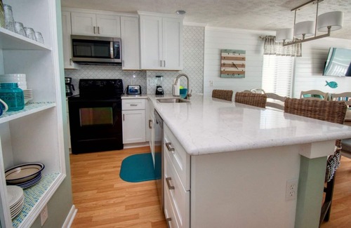 Kure Beach Condo | Top Floor Oceanfront Condo with elevator in Ocean Dunes Indoor/Outdoor Pools