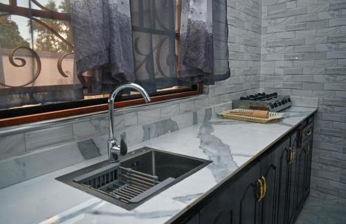 Chukwani Apartment | Tosh Home