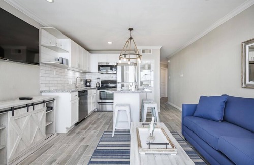 Galveston Condo | Trendy Beach Condo- Sunset views, Sandy Toes, Surfing more. (1304)