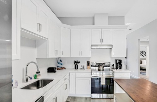 Palm Coast House | Twin villas with private pools, furnished lanais, & all-new interiors
