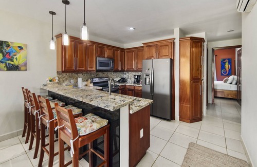 Cocoplum Condo | 'Two Cocos at the Plum' - First Floor Condo with Pier, Pool & Hot Tub