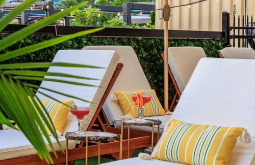 East Cesar Chavez House | Units 1+2 Inn Cahoots on 6th: 10BR/26Bed - Pool,Roofdeck, Garden Bars, Walk To Everything!