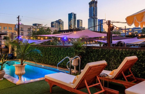 East Cesar Chavez House | Units 4+5 Inn Cahoots: 8BR/22Bed - Pool, Roofdeck, Garden Bars, Walk To Everything!