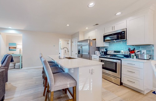 Sea Trail Condo | Updated condos in a great location with sunroom & two kitchens - dog-friendly
