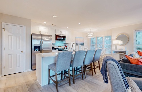 Sea Trail Condo | Updated condos in a great location with sunroom & two kitchens - dog-friendly