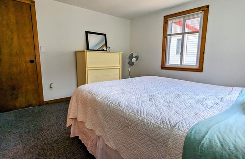 Grant House | Updated cottage with a huge deck, yard, fire pit & pontoon boat in the summer