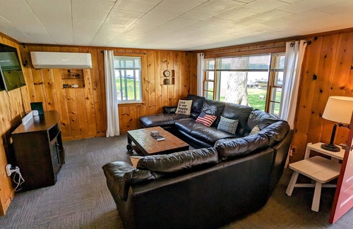 Grant House | Updated cottage with a huge deck, yard, fire pit & pontoon boat in the summer